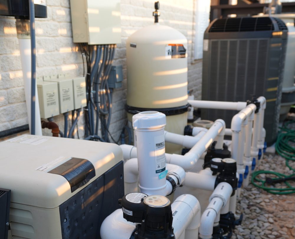 Pool equipment pad with filter, heater and pump