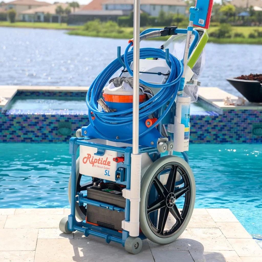Sky Blue Pools cleaning equipment beside a backyard pool